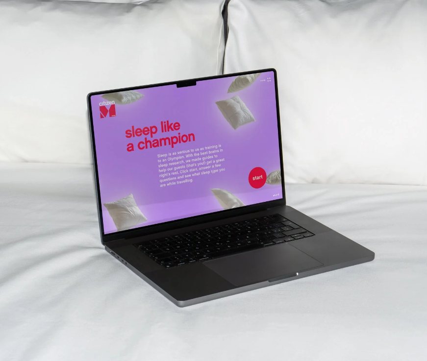 “Sleep like a champion” page open on a laptop lying in bed