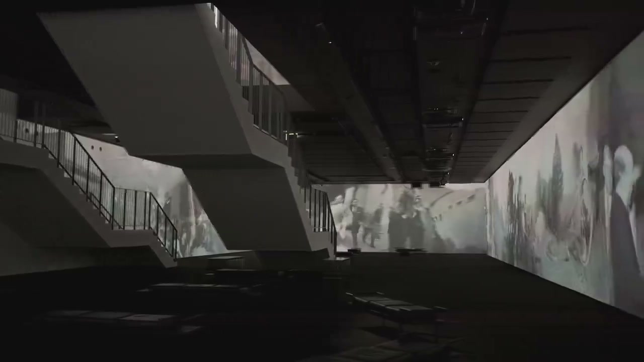 Film: projections running along the walls beneath the hall’s staircases